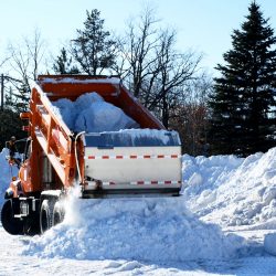 Orange,Dump,Truck,Empties,A,Load,Of,Snow,After,Several